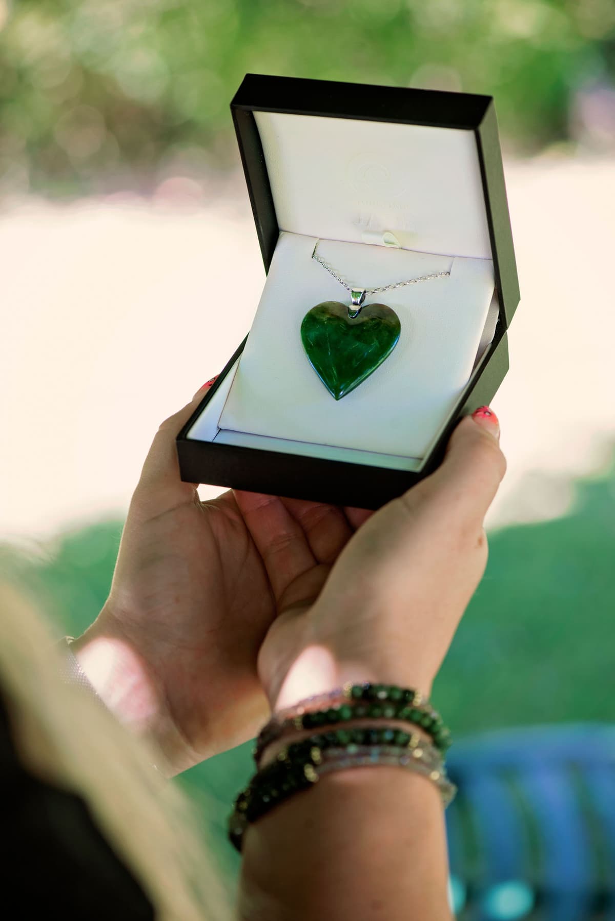 Contemporary Māori koru jewellery hand-carved from authentic New Zealand pounamu and finished with a silver setting, its flowing spiral form expressing growth, renewal and connection.