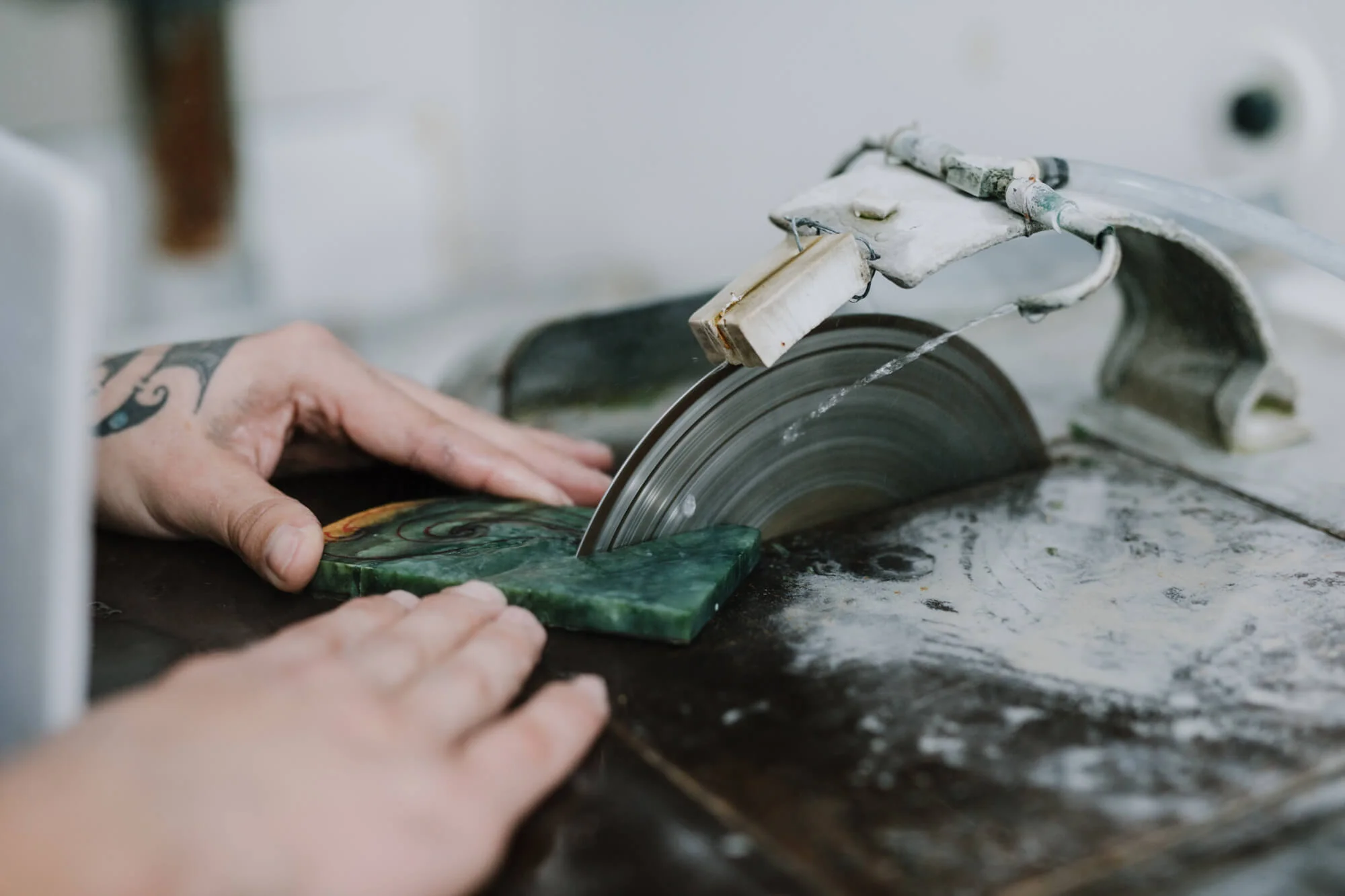 Cutting a piece of jade